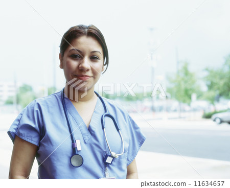 Female doctor outdoors 11634657