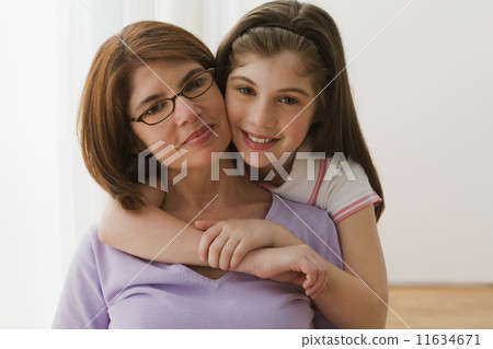 Irish mother and daughter hugging 11634671