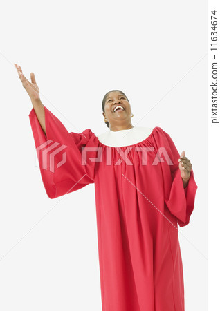 Studio shot of senior African woman wearing a choir robe and singing 11634674
