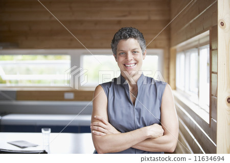 Mixed Race woman with arms crossed 11634694