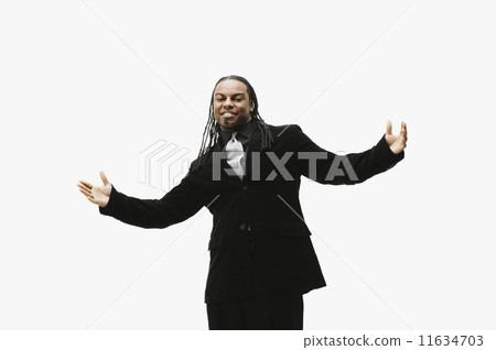 Portrait of African businessman with arms outstretched  11634703