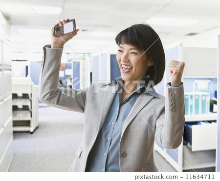 Asian businesswoman cheering Asian businesswoman cheering 11634711
