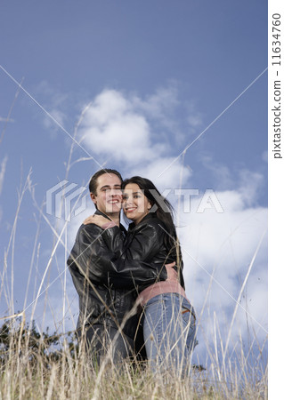 Multi-ethnic couple hugging Multi-ethnic couple hugging 11634760