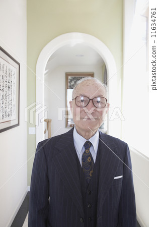 Senior man wearing suit in hallway Senior man wearing suit in hallway 11634761