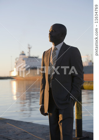 African American businessman on commercial pier 11634769