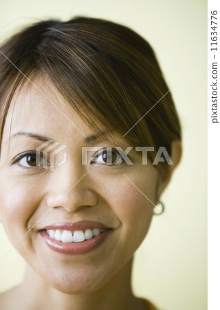 Close up of Pacific Islander woman smiling Close up of Pacific Islander woman smiling 11634776