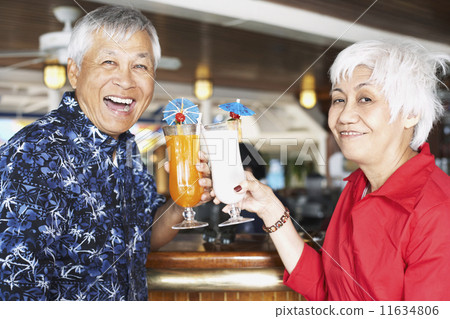 Senior Asian couple toasting 11634806