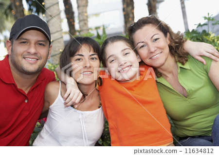 Hispanic family hugging 11634812