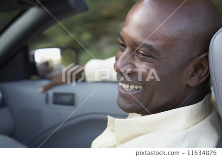 Portrait of African man in convertible car 11634876