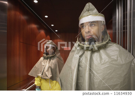 African man and woman in hazmat suits 11634930