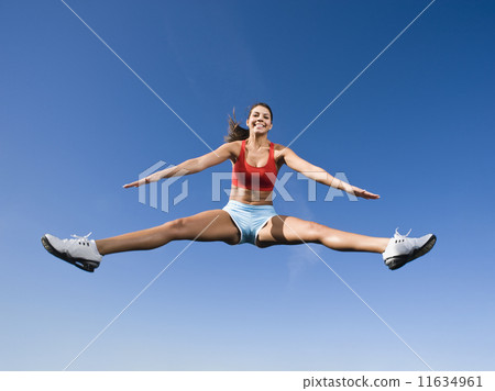 Native American woman jumping in mid-air 11634961