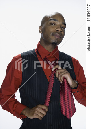 African American man adjusting tie 11634997