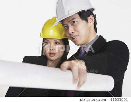 Studio shot of Asian businesspeople wearing hard hats 11635001