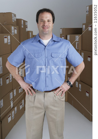 Male warehouse worker in warehouse 11635052
