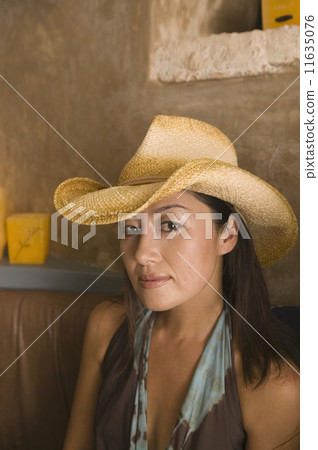 Portrait of woman wearing cowboy hat Portrait of woman wearing cowboy hat 11635076