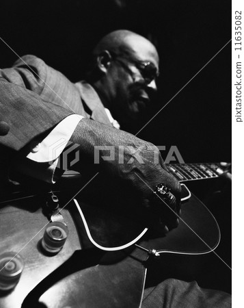 African American man playing guitar 11635082