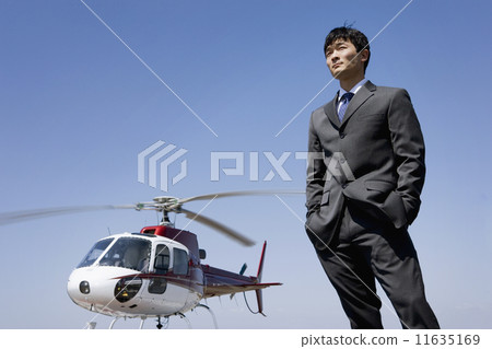 Asian businessman next to helicopter 11635169