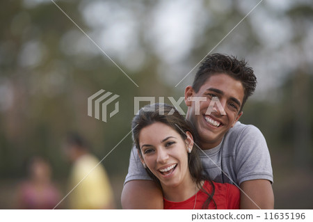 Multi-ethnic couple hugging Multi-ethnic couple hugging 11635196