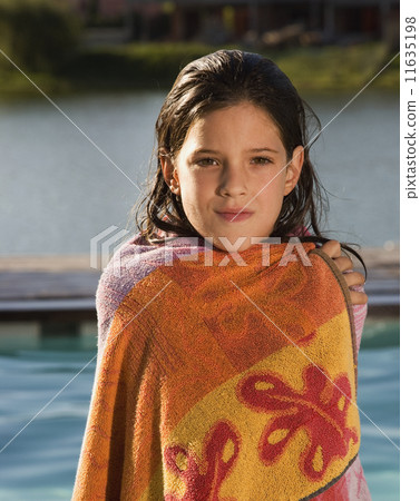 Hispanic girl wrapped in towel 11635198