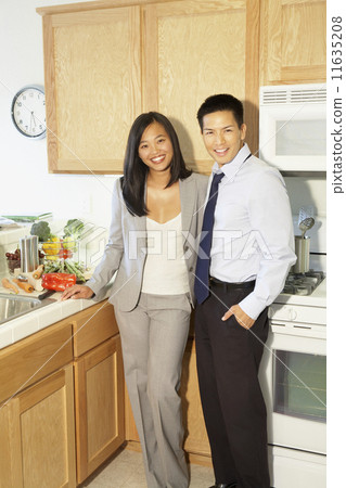 Asian couple in kitchen 11635208