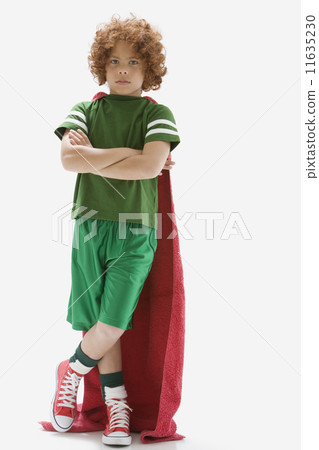 Mixed Race boy wearing towel as cape 11635230