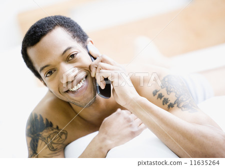 African American man talking on cell phone 11635264