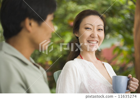 Asian woman drinking coffee 11635274