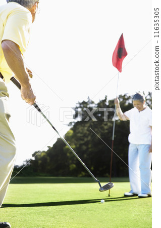 Senior Asian couple playing golf 11635305