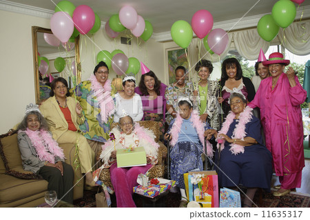Group portrait of senior adult birthday party with balloons 11635317