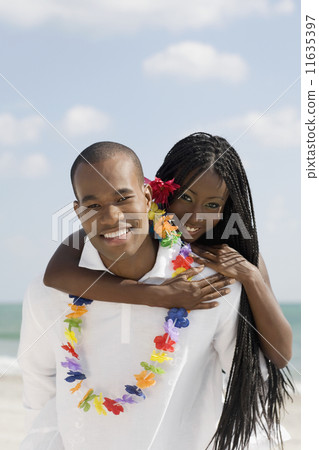 African woman hugging husband 11635397