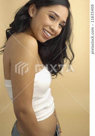 Hispanic woman wearing tube top 11635409