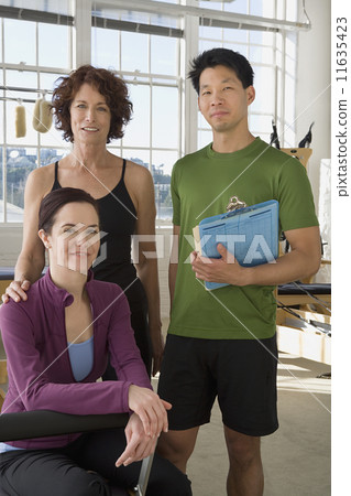 Multi-ethnic business owners in exercise studio 11635423