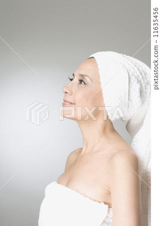 Hispanic woman wrapped in towels Hispanic woman wrapped in towels 11635456
