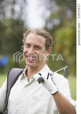 Man holding golf club on shoulder Man holding golf club on shoulder 11635617