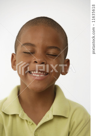 African American boy with eyes closed African American boy with eyes closed 11635618