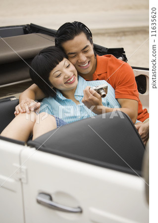 Asian couple looking at camera 11635620