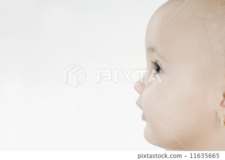 Profile of Hispanic baby with earring Profile of Hispanic baby with earring 11635665