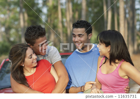 Two young couples hugging 11635731