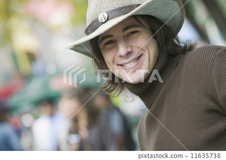 Hispanic man wearing cowboy hat 11635738