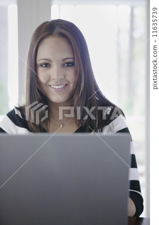 Portrait of woman with laptop Portrait of woman with laptop 11635739