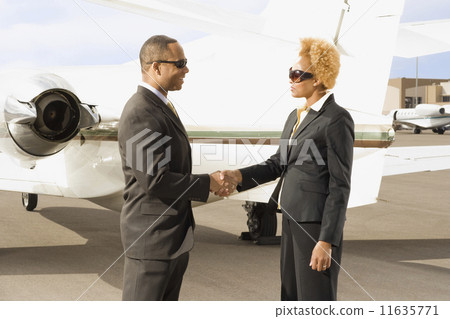 African American businesspeople shaking hands African American businesspeople shaking hands 11635771
