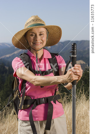 Senior woman hiking 11635773