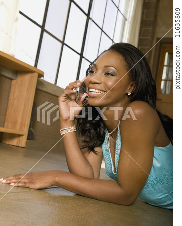 African woman talking on cell phone African woman talking on cell phone 11635809