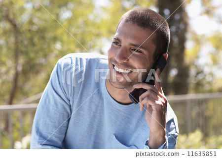 Native American man talking on cell phone 11635851