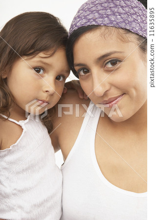 Mother and daughter smiling for the camera 11635895