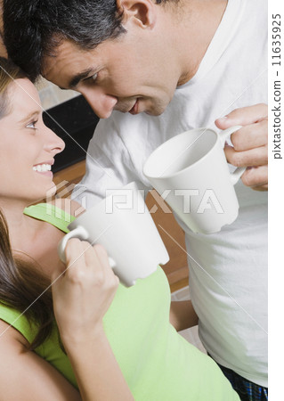 Hispanic couple drinking coffee 11635925