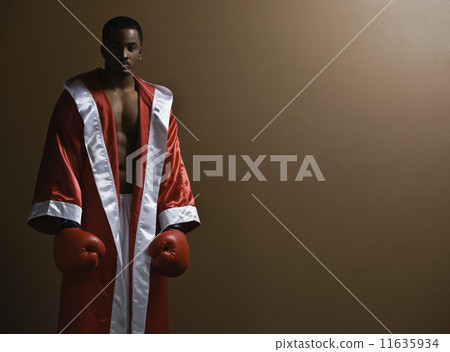 African American man wearing boxing gloves 11635934