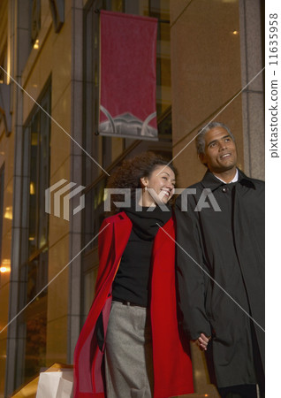 Couple holding hands while shopping Couple holding hands while shopping 11635958