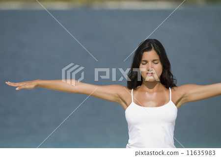 Hispanic woman practicing yoga 11635983