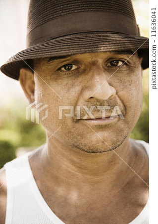 Close up of Hispanic man wearing hat Close up of Hispanic man wearing hat 11636041